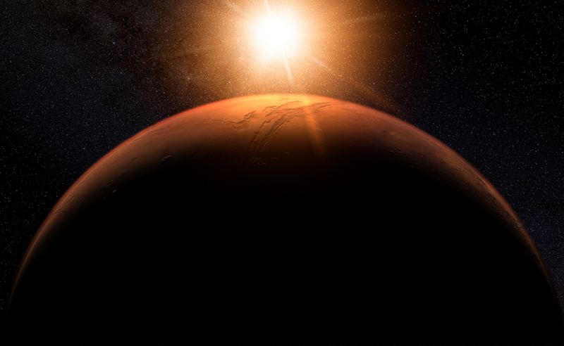 Os raios do sol incidem na atmosfera do planeta Marte, formando um círculo de luz. Imagem digital por Kevin Gill.