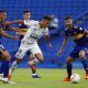 Kaio Jorge of Brazil's Santos is challenged by Lisandro Lopez of Argentina's Boca Juniors